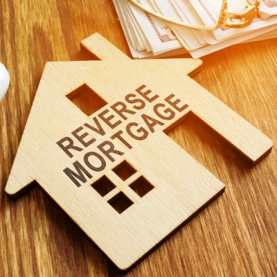 Reverse Mortgage Stamp on a Model of House