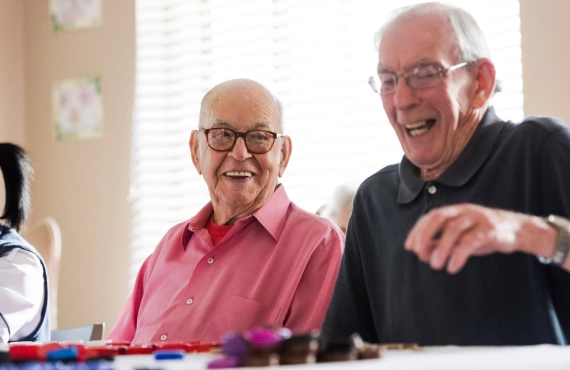 Senior Men Laughing Playing Bingo Together