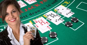 Splitting in Blackjack - Woman Smiling Holding Ace and King of Spades