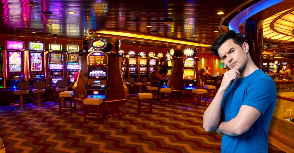 Curious Man Thinking Touching His Chin - Slot Machines in the Casino