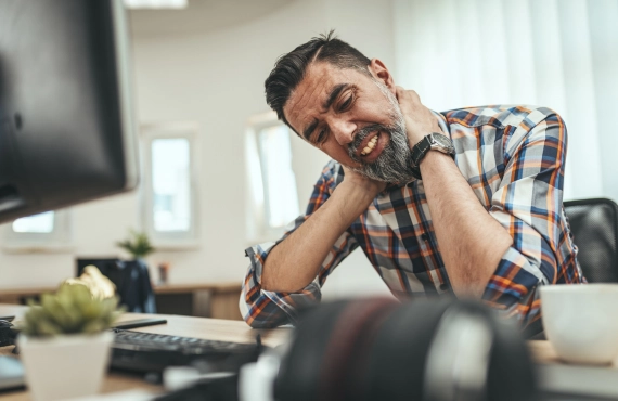 A Man Struggling  Sitting in Front of a Computer