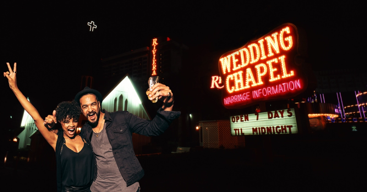 Las Vegas, Wedding Chapel Illuminated at Night - Couple Having Fun