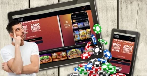 Smartphone and Digital Tablet PC Showing Caesars Palace Online Casino HUB - Man Thinking - Casino Chips