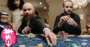 A Man Placing Bets on the Roulette Table - Paper cut Head with Jigsaw Puzzle Pieces Inside