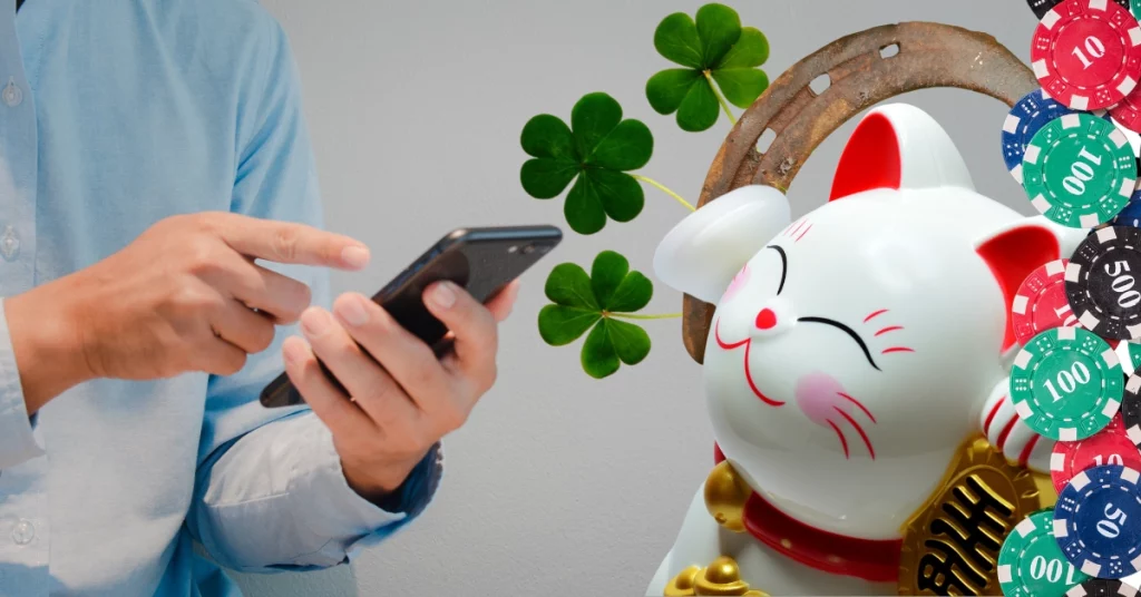 Close Up Man Hand Holding Mobile Smartphone - Lucky Charms - Casino Chips